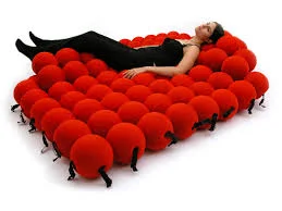 26. Cozy soft red balls bed