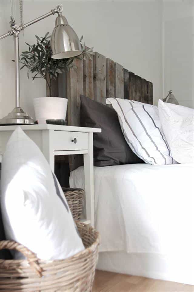 11. SCANDINAVIAN INFUSED BEDROOM DESIGN WITH A PALLET BED FRAME AT ITS CENTER