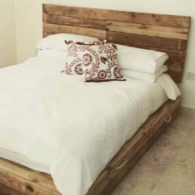 SIMPLE BED FRAME WITH STORAGE SPACE MADE OUT OF PALLET WOOD