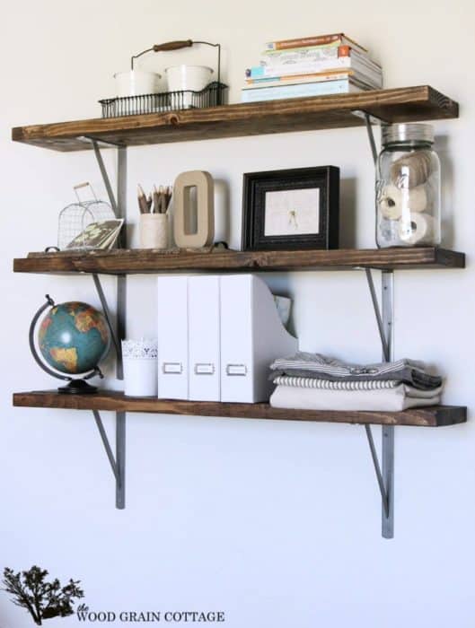 1. Use reclaimed wood to create these classic farmhouse flair shelving unit