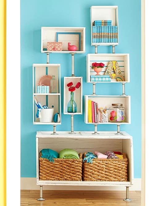 11. For less than $100, you can create a beautiful shelving unit from old pipes and wooden crates