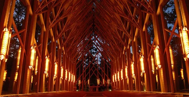 Thorncrown Chapel by E. Fay Jones perfect ilumination unusual shape and size perfect integration modern concept design visitors in the middle of the forest interior lighting religious atmosphere