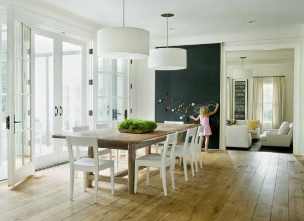 black wall used as an accent to deocrate the clean minimalsit dinning space