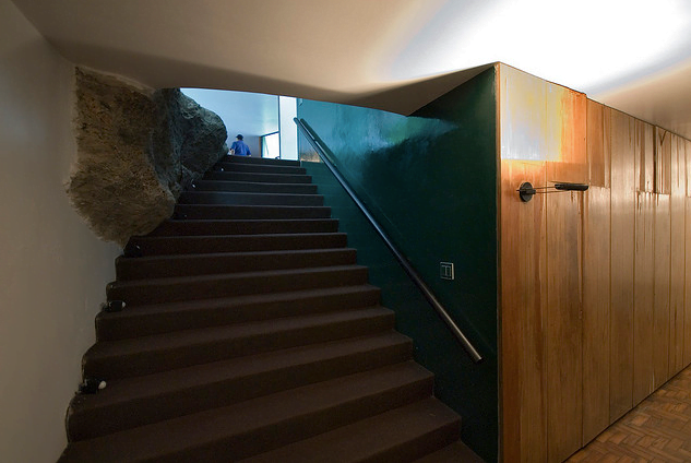 interior staircase involving the huge boulder, part of the site unmistakable The Home of a Legend-Casa das Canoas by Oscar Niemeyer in Rio de Janeiro homesthetics (1)