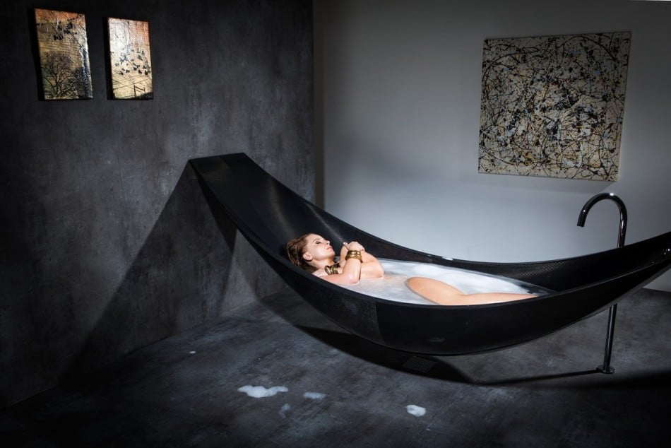 lady having a bath modern black hammock-bathtub-design-made-from-layers-of-carbon-fiber-by-Splinter-Works-sleek-bath-tub-floating-bath-tub-Homesthetics-1 (20)