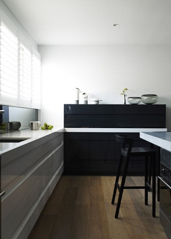 Contemporary Black Interior Design with Vibrant Accents black and white kitchen