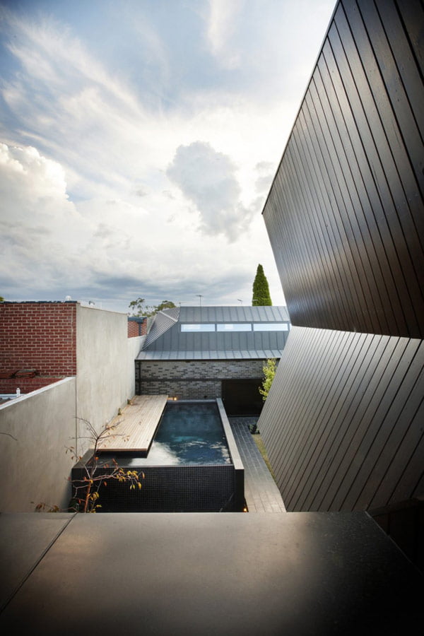 Mix of Styles in Enclave House by BKK Architects in Melbourne Australia pool view
