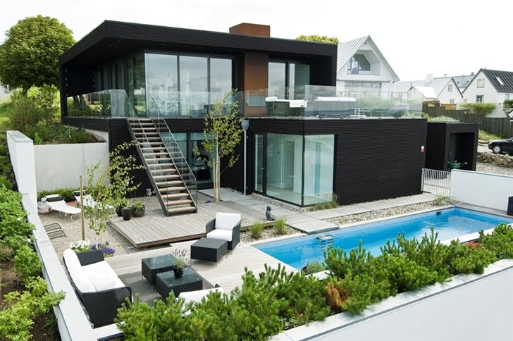 main black facade of the Nilsson Villa-Modern Beach House With Black and White Interior Design in Sweden