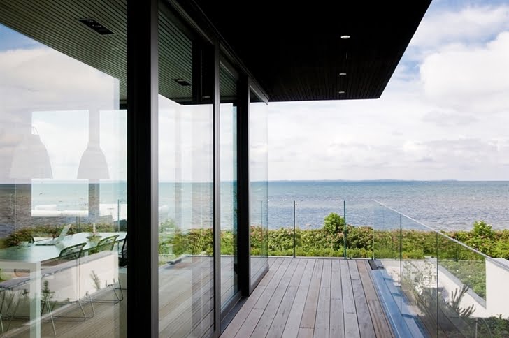 view from the balcony Nilsson Villa-Modern Beach House With Black and White Interior Design in Sweden 