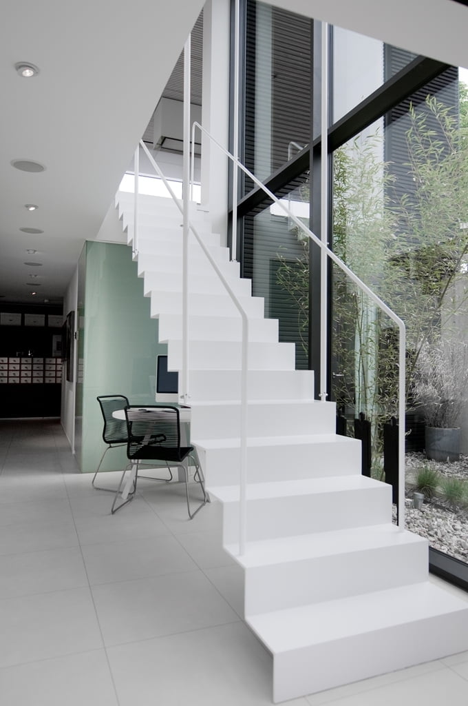 white stark modern staircase floating Nilsson Villa-Modern Beach House With Black and White Interior Design in Sweden 