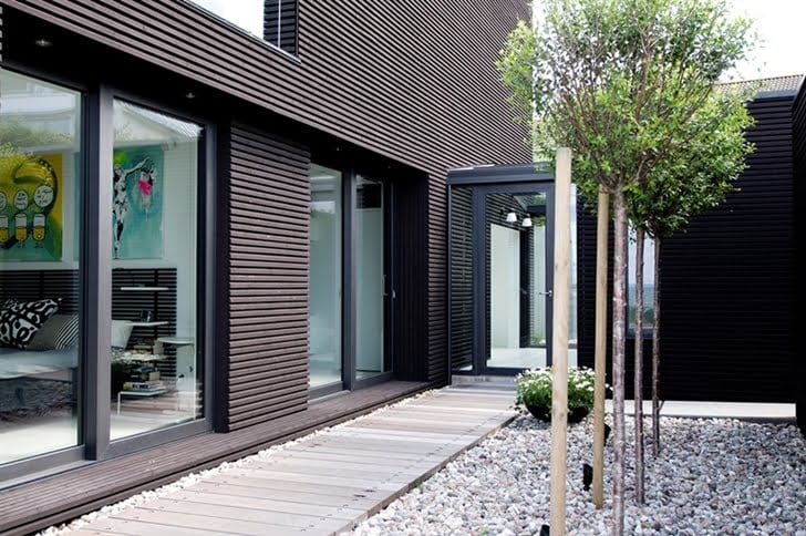 access into the Nilsson Villa-Modern Beach House With Black and White Interior Design in Sweden 