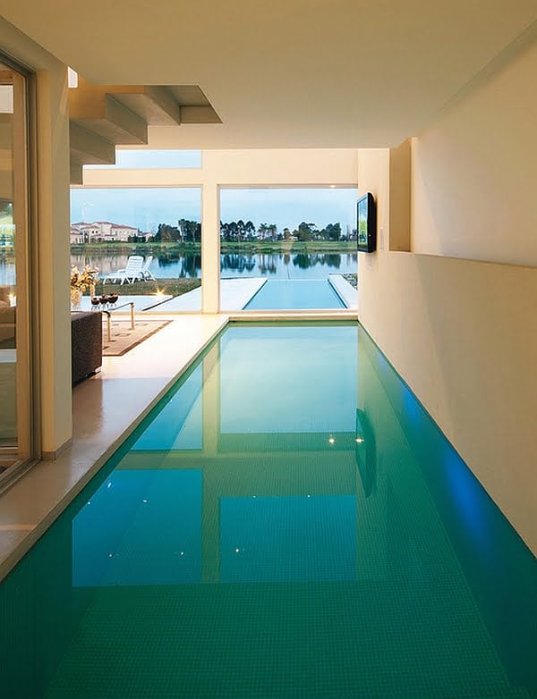 Minimalist Interior Swimming Pool Design Communicating with the Exterior Infinity Pool