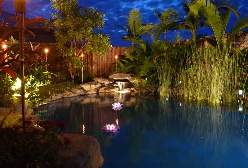 Brilliant LED Lighting Enhancing a Natural Pool Magnificently