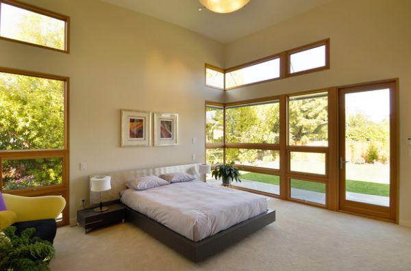Wood and Expansive Views Enhancing a High Ceiling Master Bedroom with a Floating Bed