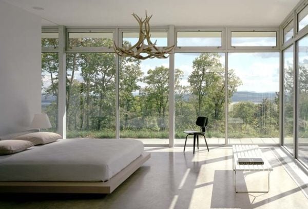 Unique Chandelier Above a Bedroom with Expansive Views Surrounding a Floating Bed
