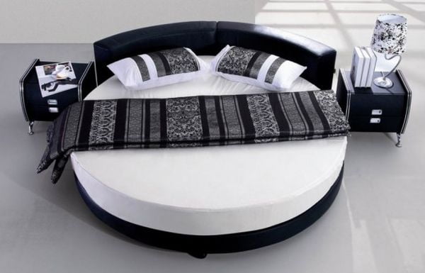 Black and white minimalist round bed.