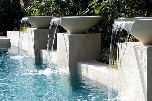 Unusual Waterfalls Enhancing a Swimming Pool