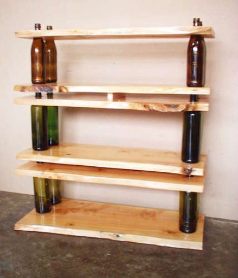 Simple solution for shelves can be realized by teaming up empty bottles and wood boards