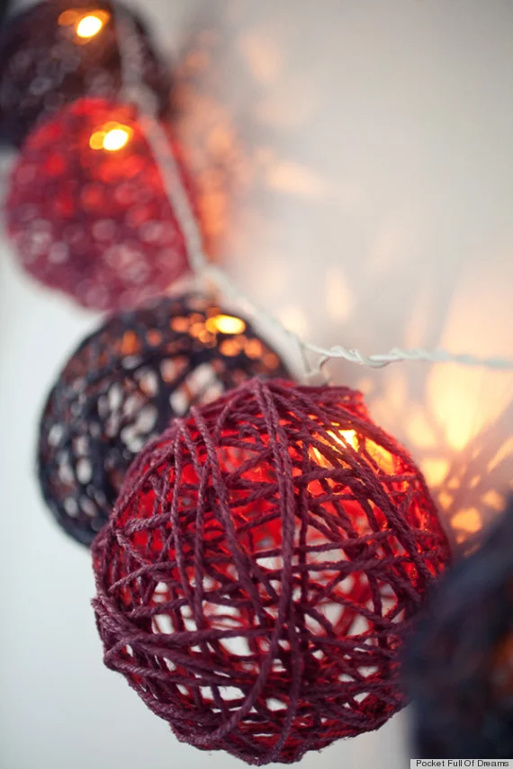 1. Glued colored rope balls turned into holiday shimmering light installation
