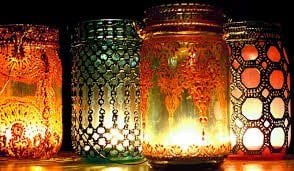 14. Paint mason jars and place candles inside for a mysterious light play