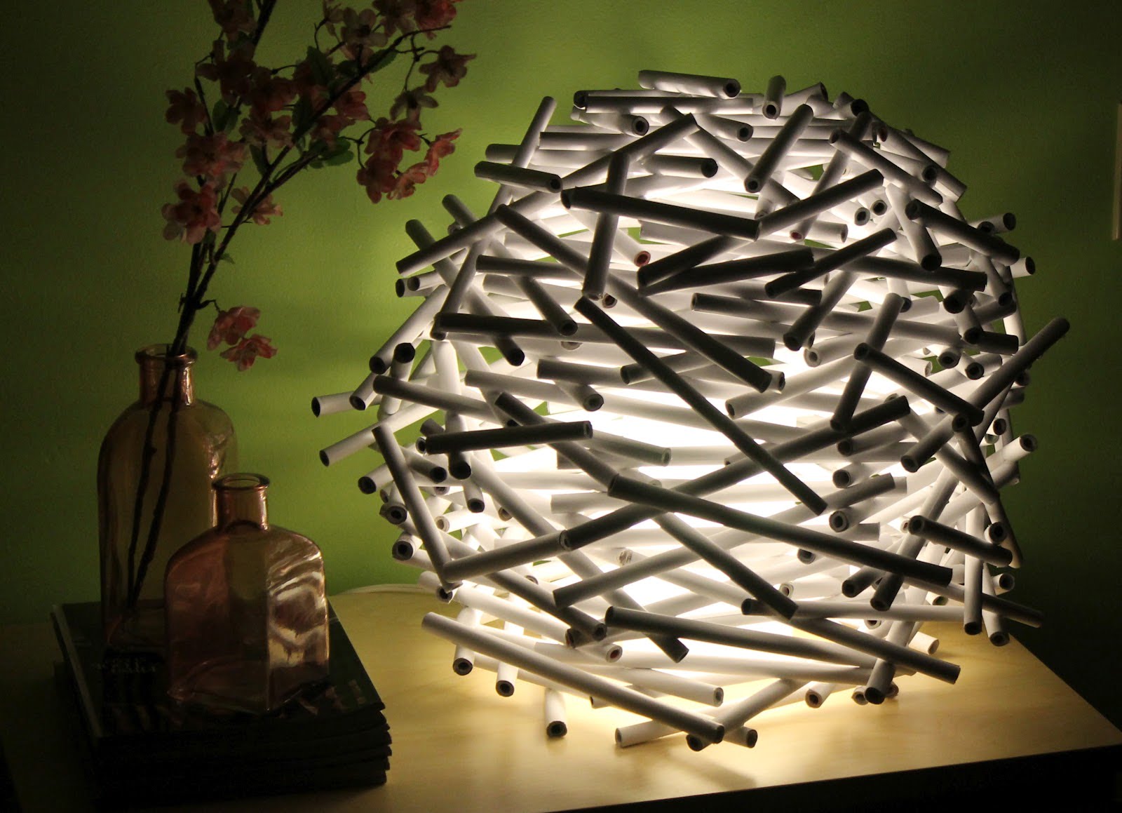 15. Glue PVC sticks in a round shape and add some light for an interesting effect