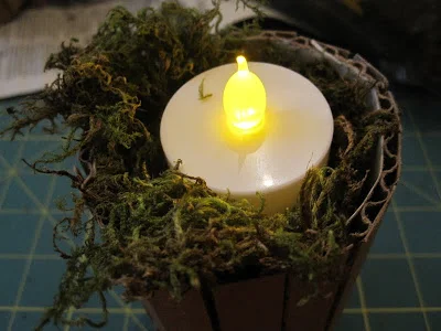 16. Use old cardboard to make an easy DIY candle holder