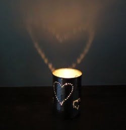 20. Perforate a tin can into a heart shape and add a candle