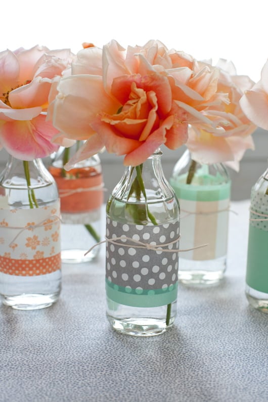 13. REVIVE OLD BOTTLES WITH COLORFUL PAPER AND USE THEM AS FLOWER VASES