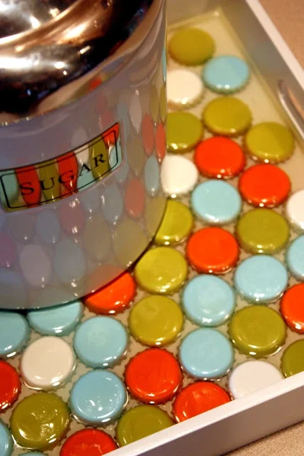 beautiful colorful serving tray realized with bottle caps