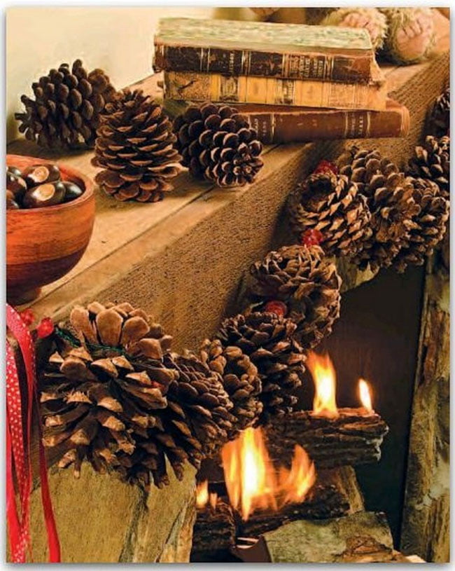 Pinecone Garland Enhancing a Spectacular Fireplace