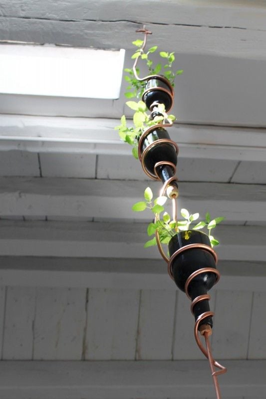 suspended wine bottle planter with copper wire