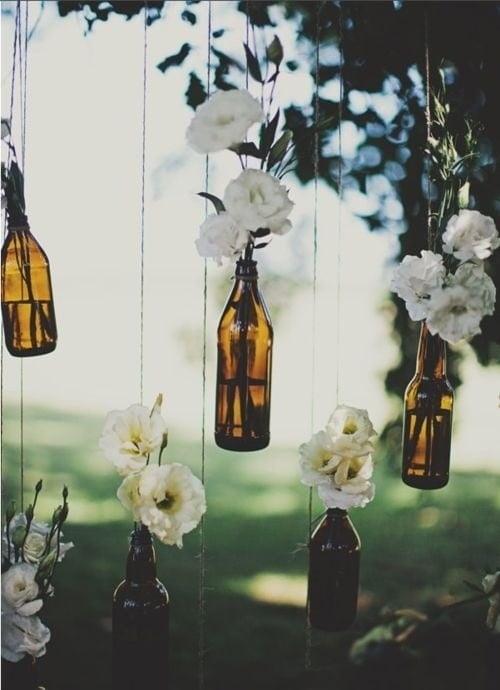 suspended glass bottle installation doubling as a wall divider