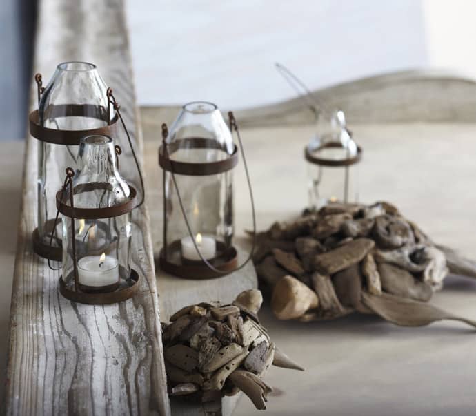 glass votive candles in metal salvaged lanterns