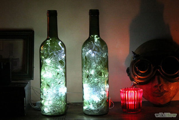 Add twinkling lights to wine bottles for a special lamp design
