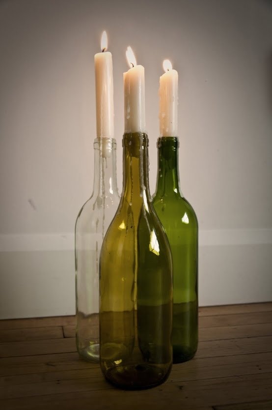 Use old wine bottles as candle holders that reflect light beautifully