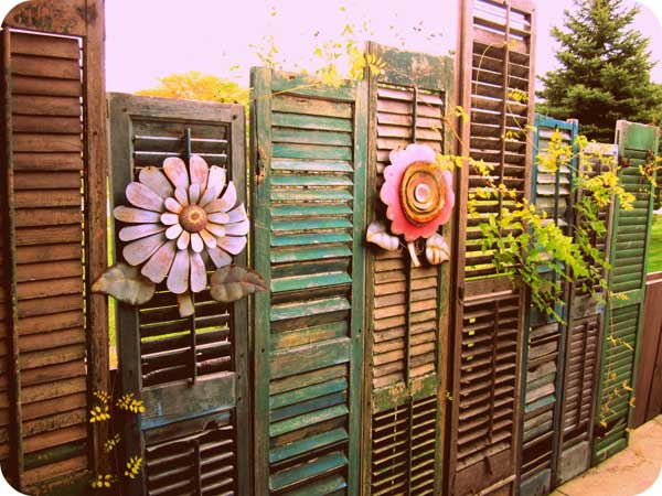21.OLD SHUTTERS REUSED IN A VINTAGE FENCE