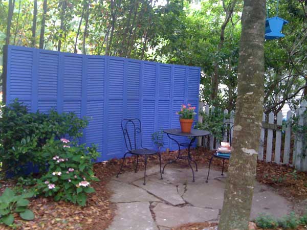 8.PAINT AND REUSE SHUTTERS AS PRIVACY SCREENS AND FENCES