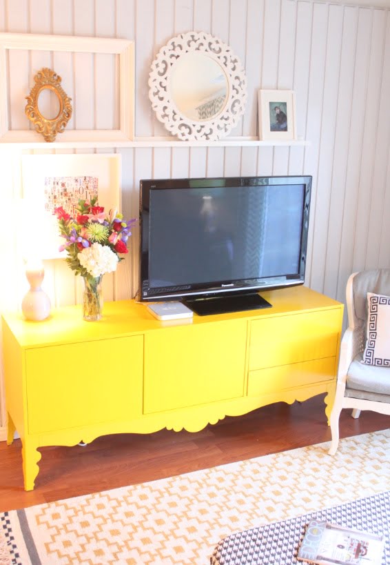 #11 TV Sitting on a Yellow Stand In Airy Decor