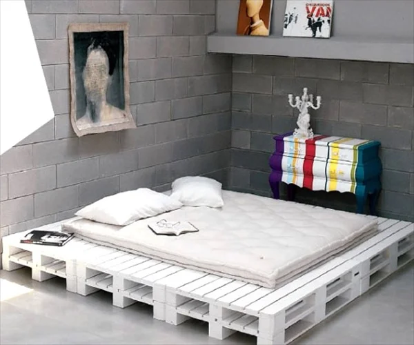 #18 BRICK WALL AND ECLECTIC PIECES BY A SIMPLE WHITE PALLET BED