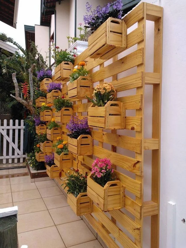 #11 OUTDOOR WOODEN PALLETS CARRYING PLANTERS AND FLOWERS