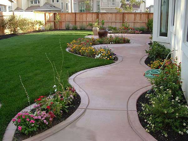 #35 Organic Cement Sidewalk Defined by Flowers and Grass