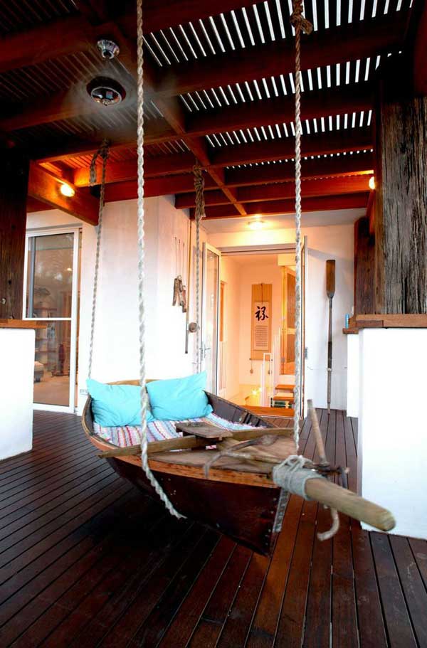 #2 re-purpose an old boat into a cool hammock on the porch