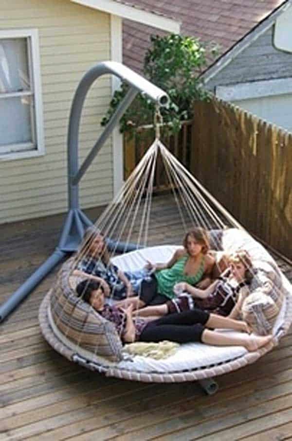 #5 use an old trampoline as a swing and outdoor bed