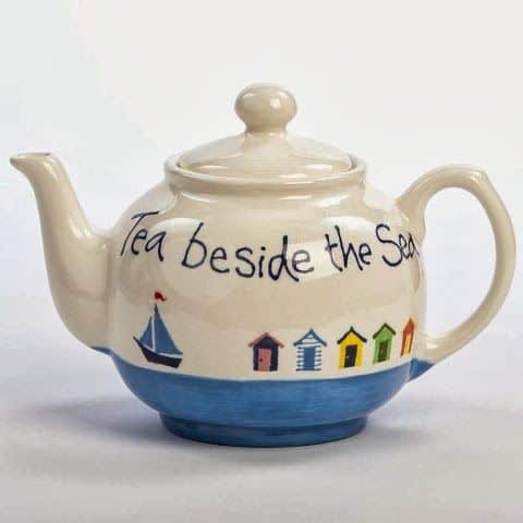 #10 POTTERY PAINTED TEA POT DEPICTING A PLACE BY THE SEA