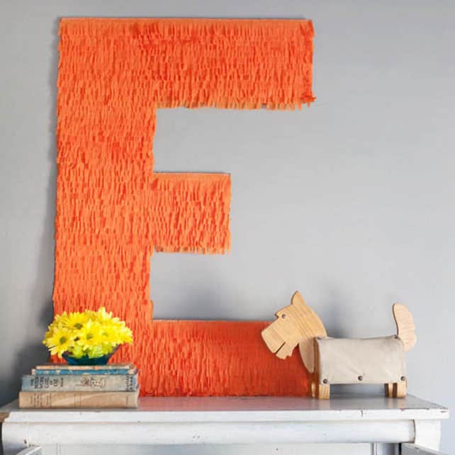 #21 FRINGE USED ON ONE SIDE OF THIS LARGE MONOGRAM TO ENHANCE A BLANK WALL