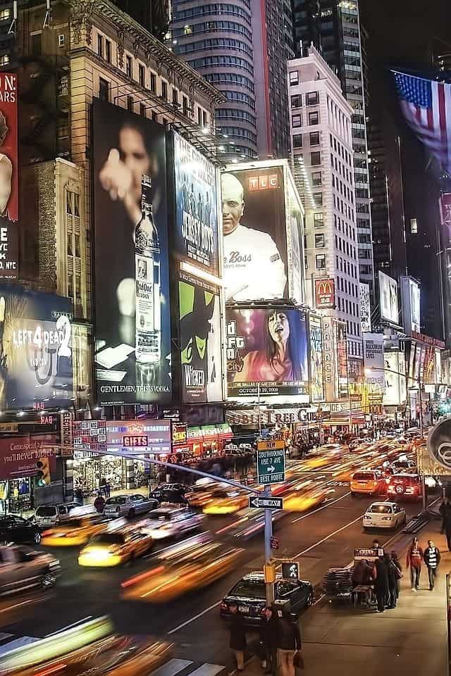 #10 Times Square  with its many lighted billboards and variety of stores capturing the spirit of New York city