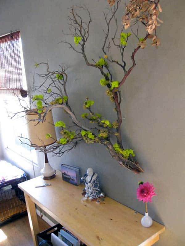 #20 SCULPTURAL BRANCH DECORATING A GRAY WALL