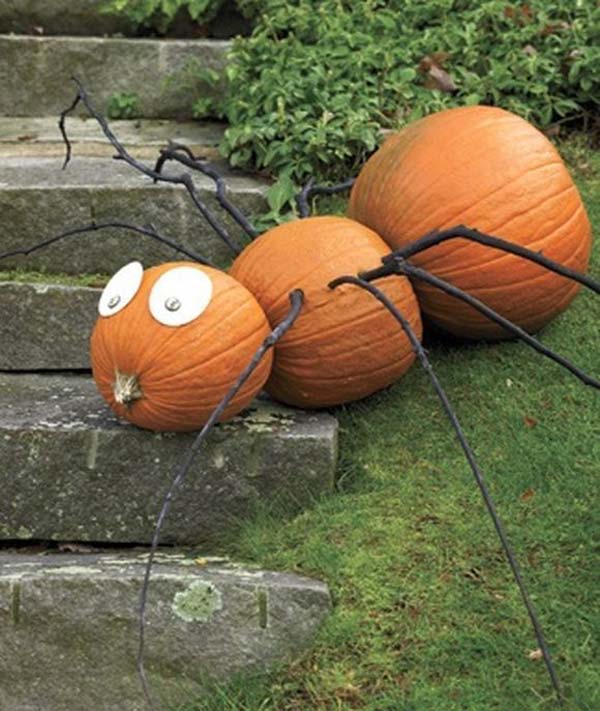 #6 TRANSFORM THREE PUMPKINS INTO A SPIDER WITH THE HELP OF BLACK PAINTED BRANCHES