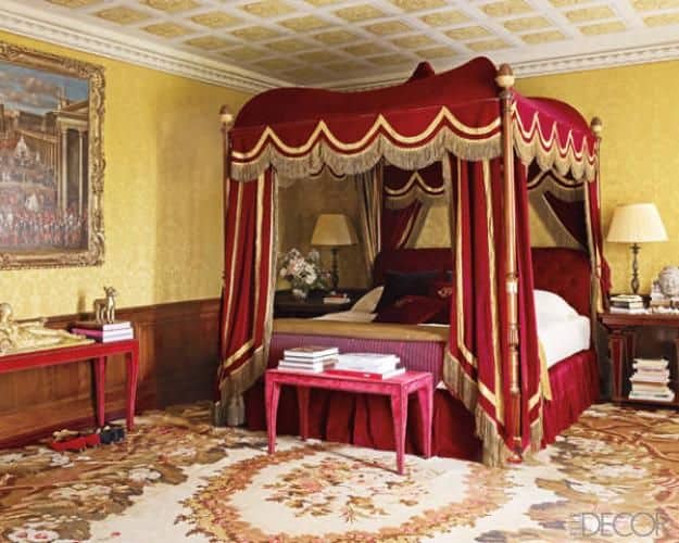 #12 make a small bedroom look majestic by using bold red velvet draping with stripes of gold
