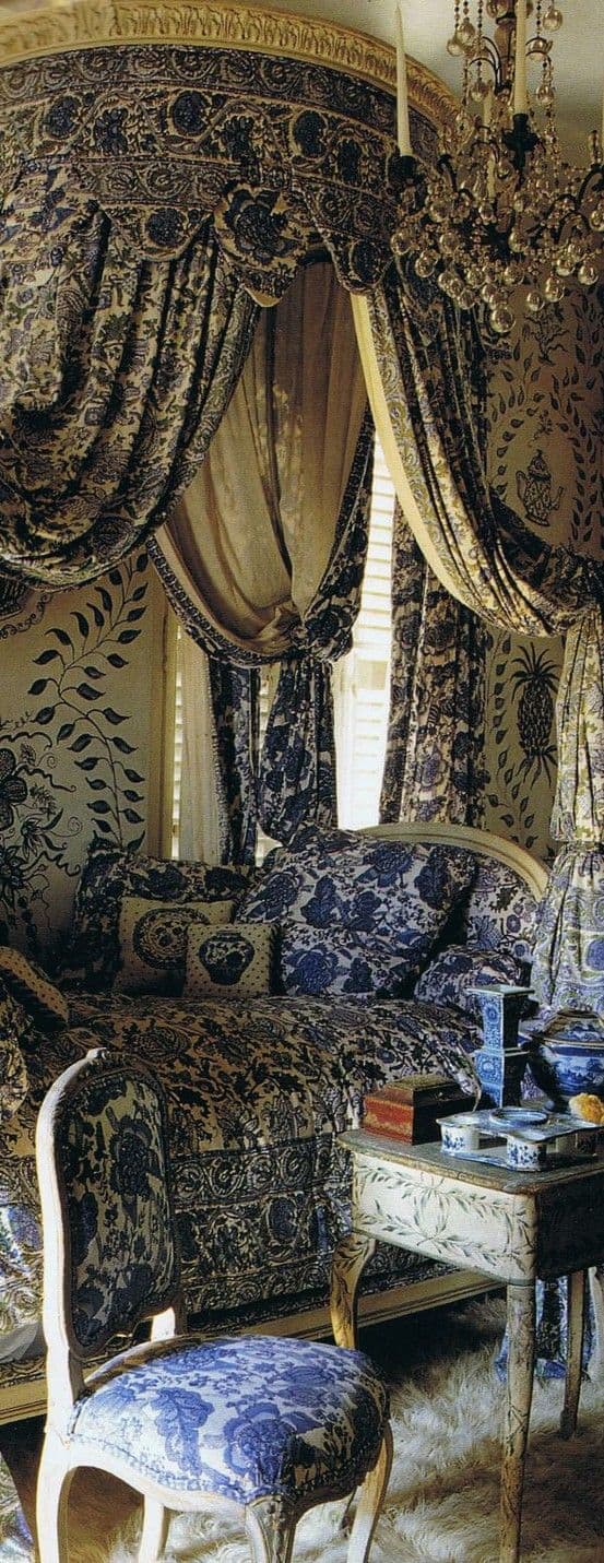 #14 materialize a royal blue luxury canopy bed with gold rim on the ceiling next to a crystal chandelier